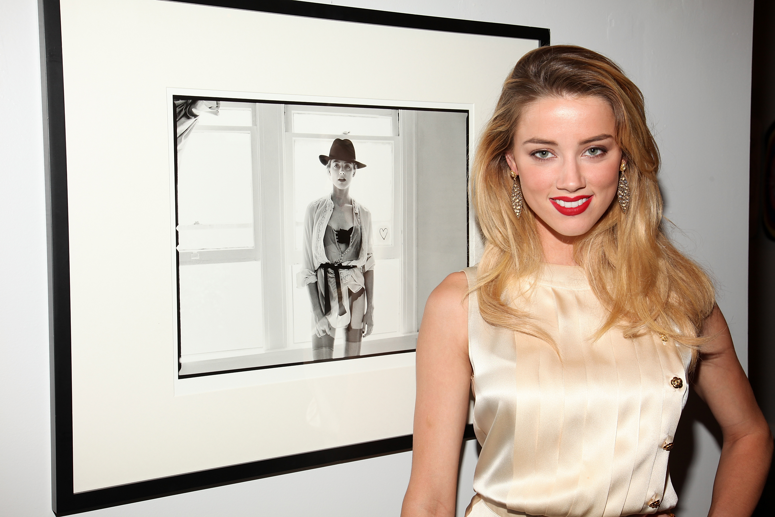 BEVERLY HILLS, CA - AUGUST 11: ***EXCLUSIVE*** Amber Heard attends photographer Tasya Van Ree's new exhibition