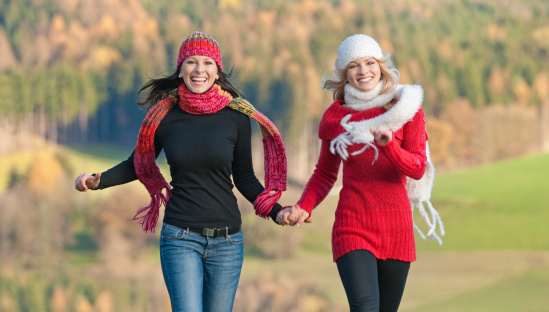 two-women-running-in-hats
