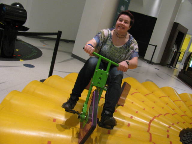 Me at the Museum of Mathematics in Manhattan. The tricycle has square wheels with the same side lengths as the arcs on the platform, so you can ride itÑit's really cool.