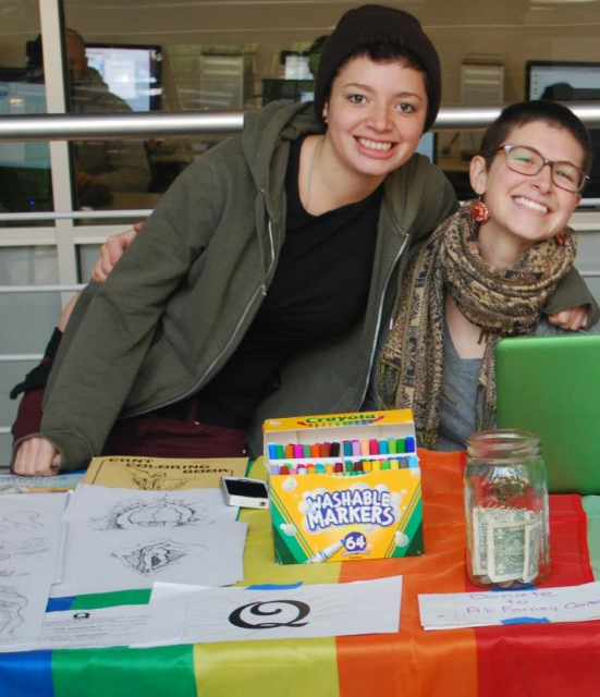 Maddy with her friend Chris (left) tabling for Q.