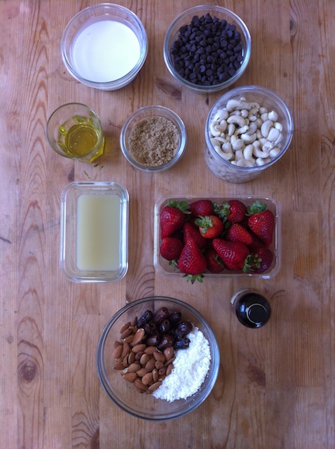 almonds, coconut and dates sitting by a tree