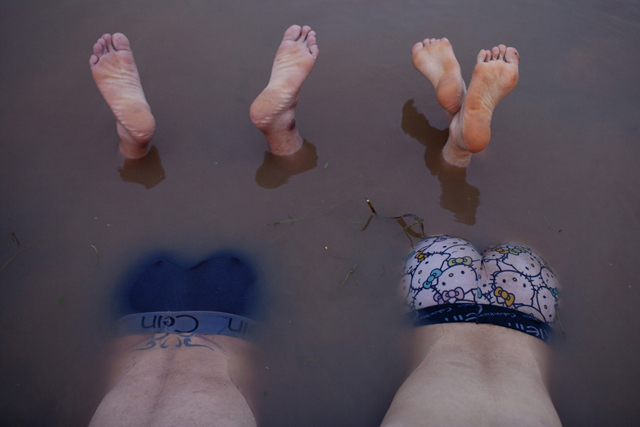 Phong and Hoang bathe in the Red River