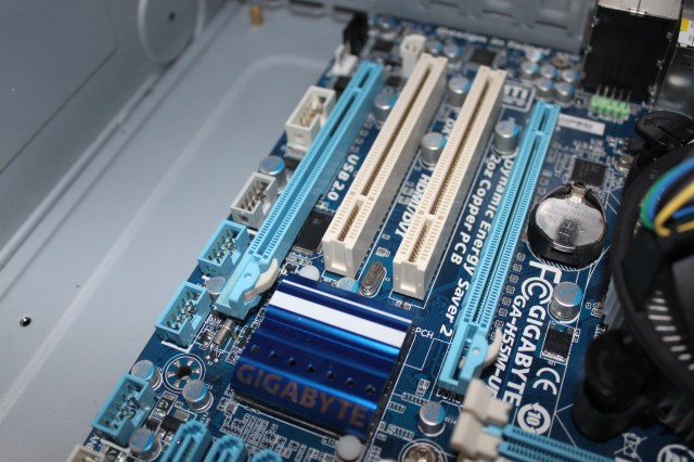 The longer blue slots are the PCIe slots, which will take modern graphics cards. The shorter ones are older generations of PCI.