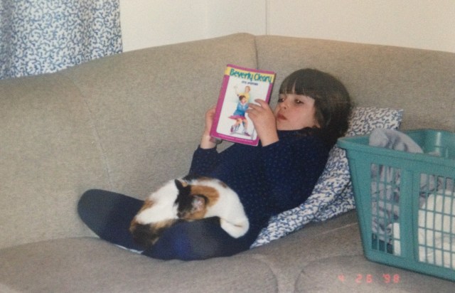 A baby Maddie Taterka (Autostraddle Contributing Editor) with her baby kitteh.