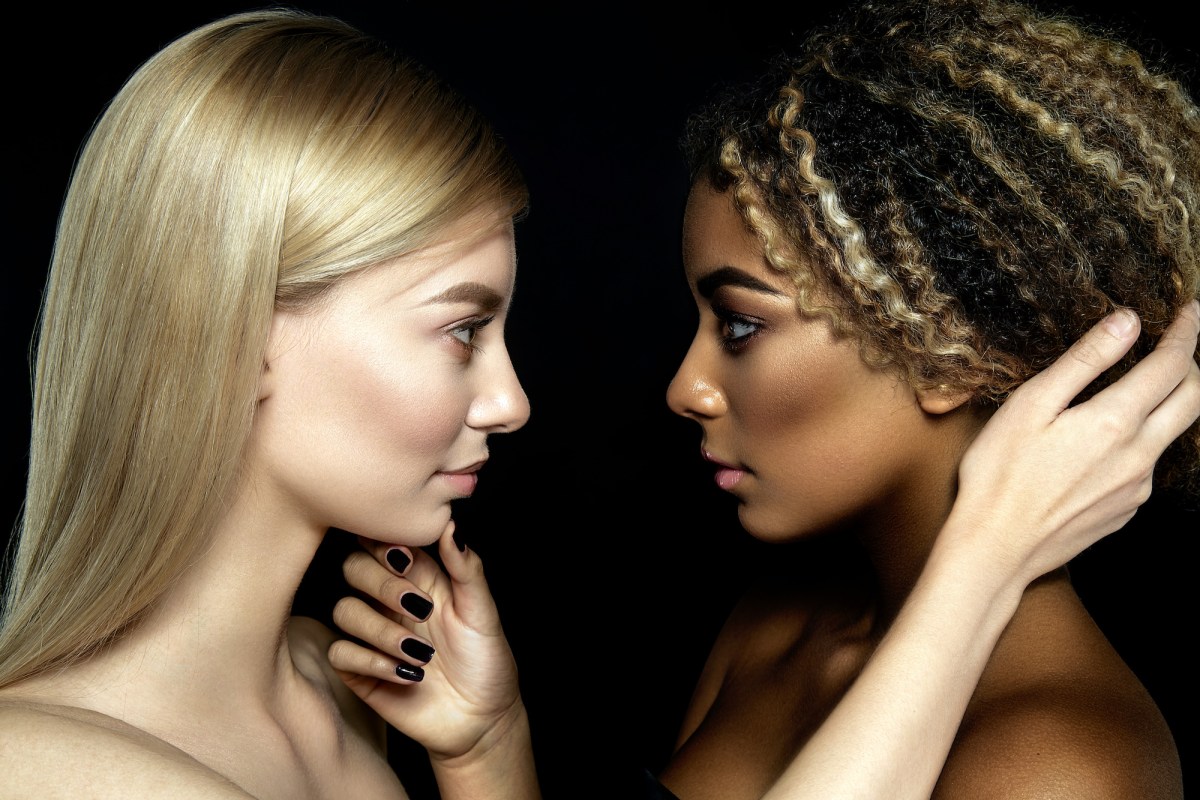 two women staring into each other's eyes in a lesbian sexy photo