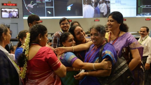 Staff from the Indian Space Research Organization celebrate at the ISRO Telemetry, Tracking and Command Network in Bangalore after their Mars Orbiter spacecraft successfully entered Mars orbit on September 24, 2014. Via PRI.