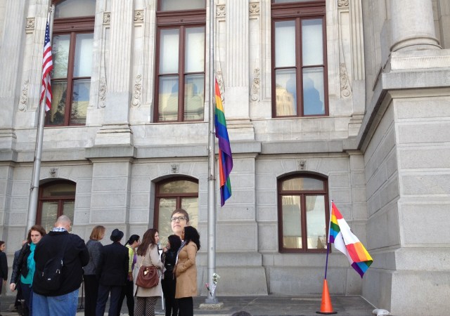 Community members gathered at City Hall to remember Casarez and lower the Rainbow Flag to half-mast.