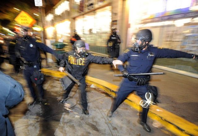 "Berkeley police officers advance on a crowds during demonstrations in Berkeley, California on Saturday, December 6, 2014." photo by Josh Edelson of the San Francisco Chronicle