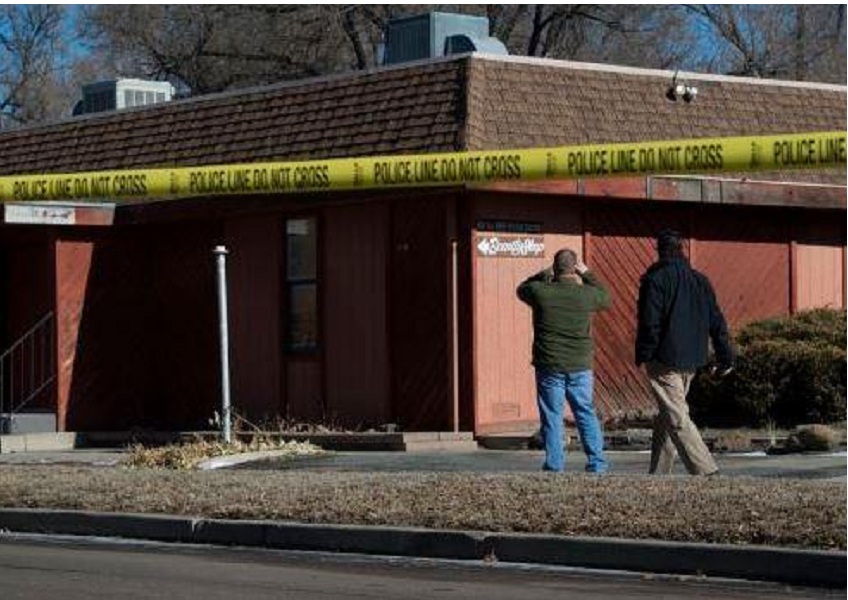 Colorado Springs police investigate the scene of an explosion Tuesday, Jan. 6, 2014, near the Colorado Springs chapter of the NAACP. (The Gazette, Christian Murdock)