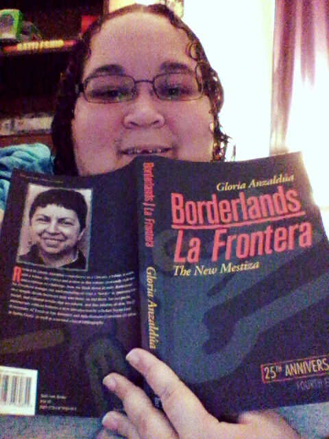 Dani reading Borderlands/La Frontera