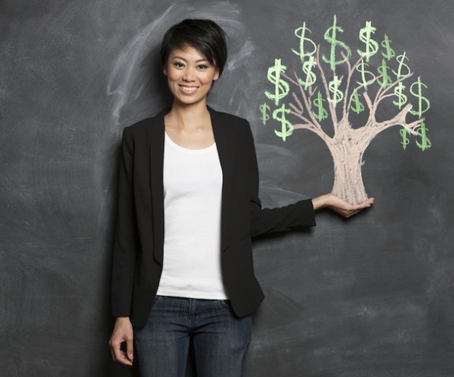 You will be like this stock photo of a woman holding a perfectly balanced money tree once you start dealing with your debt instead of hiding from it. (via Shutterstock)