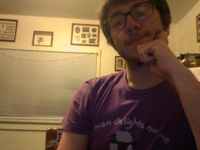 Here's Pete wearing an asexual pun shirt that says "Man delights not me no, NOR woman neither," which is both a line from Hamlet and a joke because NOR stands for Non-Oriented Ram, which I guess is a scientific classification for asexual rams. It's also the colors of the Asexual Flag. Jeez, that's a lot of layers