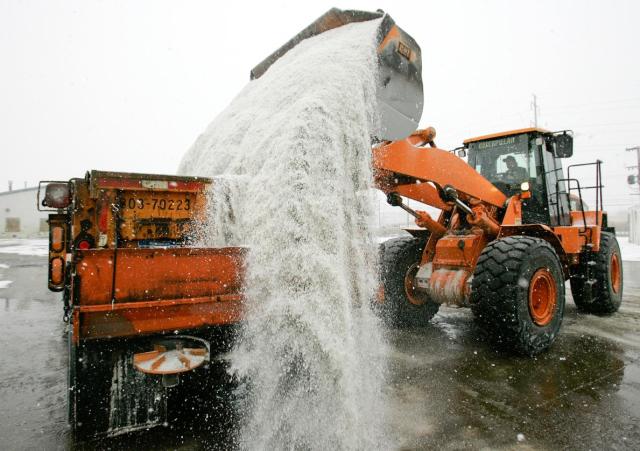 Rock salt is loaded at a facility near Detroit, Michigan; the city has its own rock salt mine. PHOTOGRAPH BY PAUL SANCYA, AP. Via National Geographic.