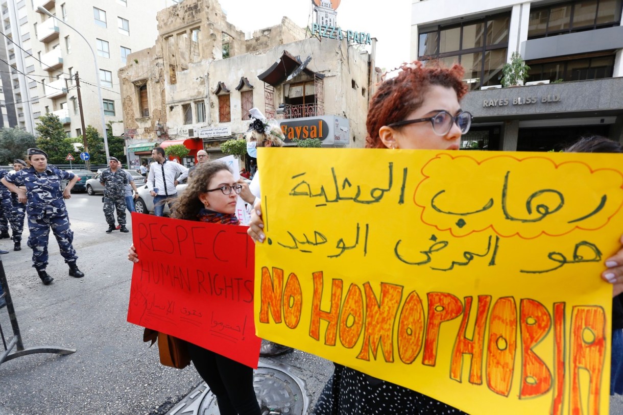 Activists from of the lebanese LGBT community take part in a protest outside the Hbeish police station in Beirut on May 15, 2016, demanding the release of four transsexual women and calling for the abolishment of article 534 of the Lebanese Penal code, which prohibits having sexual relations that "contradict the laws of nature". / AFP / European Commission / ANWAR AMRO (Photo credit should read ANWAR AMRO/AFP/Getty Images)