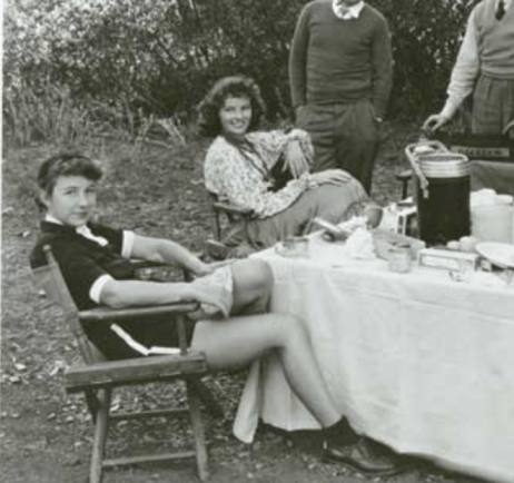 Laura Harding (Katherine Hepburn is sitting behind her)