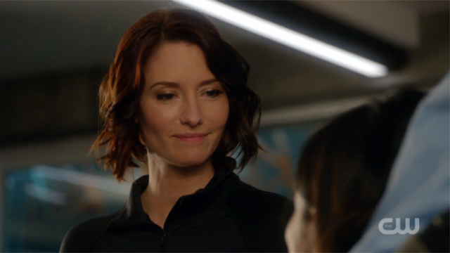 Alex smiles appreciatively at Maggie.