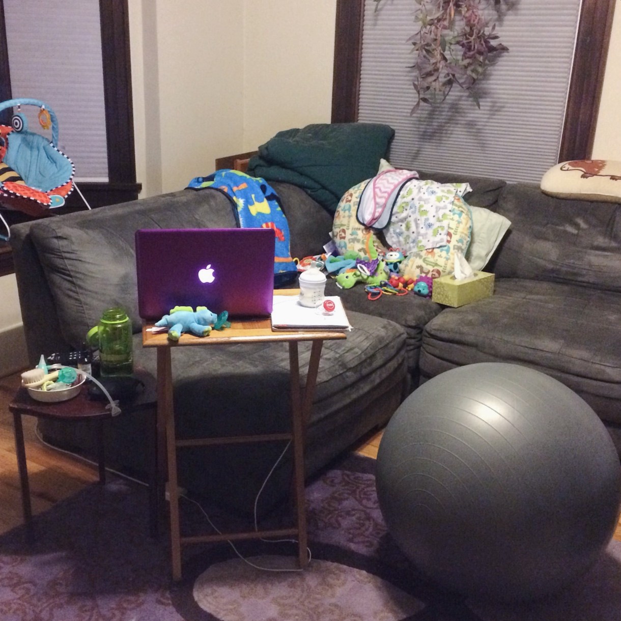 Kaelyn: Trusty MacBook, Gold Fibre project planner notebook, Nalgene of h2o from a Janelle Monae concert, nipple butter, earbuds, chapstick, a ton of pacifiers, exercise ball (doubles as "desk" "chair" when bouncing the baby), and a million other baby things.