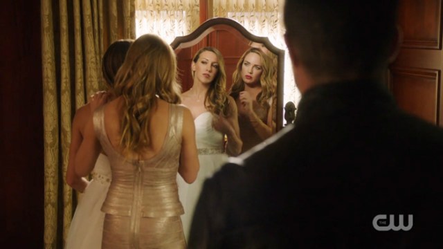 Sara and Laurel in their wedding outfits in the mirror m.