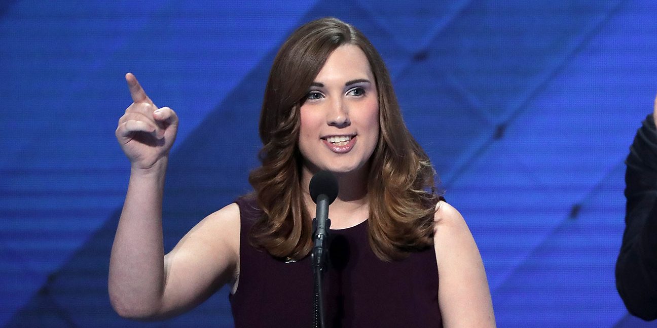 LGBT rights activist Sarah McBride delivers remarks as Co-Chair of the Congressional LGBT Equality Caucus Congressman Sean Patrick Maloney looks on during the fourth day of the Democratic National Convention at the Wells Fargo Center, July 28, 2016 in Philadelphia, Pennsylvania. Democratic presidential candidate Hillary Clinton received the number of votes needed to secure the party's nomination. An estimated 50,000 people are expected in Philadelphia, including hundreds of protesters and members of the media. The four-day Democratic National Convention kicked off July 25.