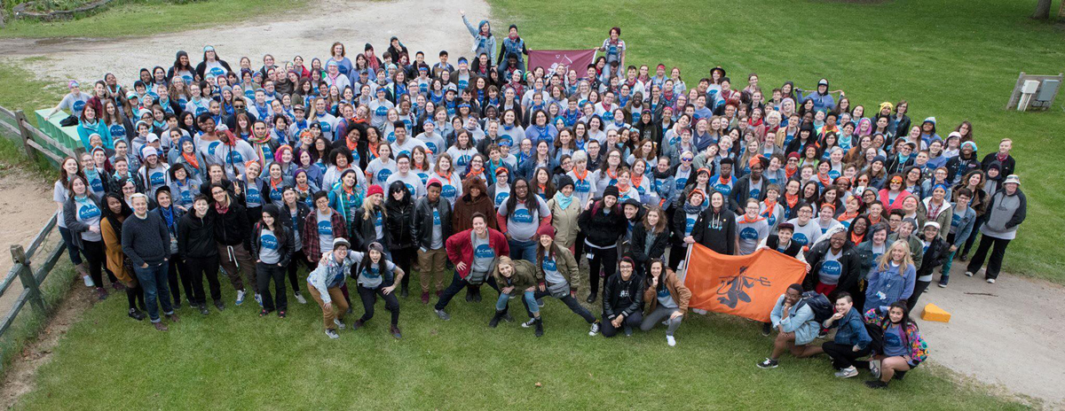 a-camp group photo wearing tees