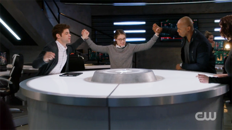 Kara aggressively high fives James and Winn