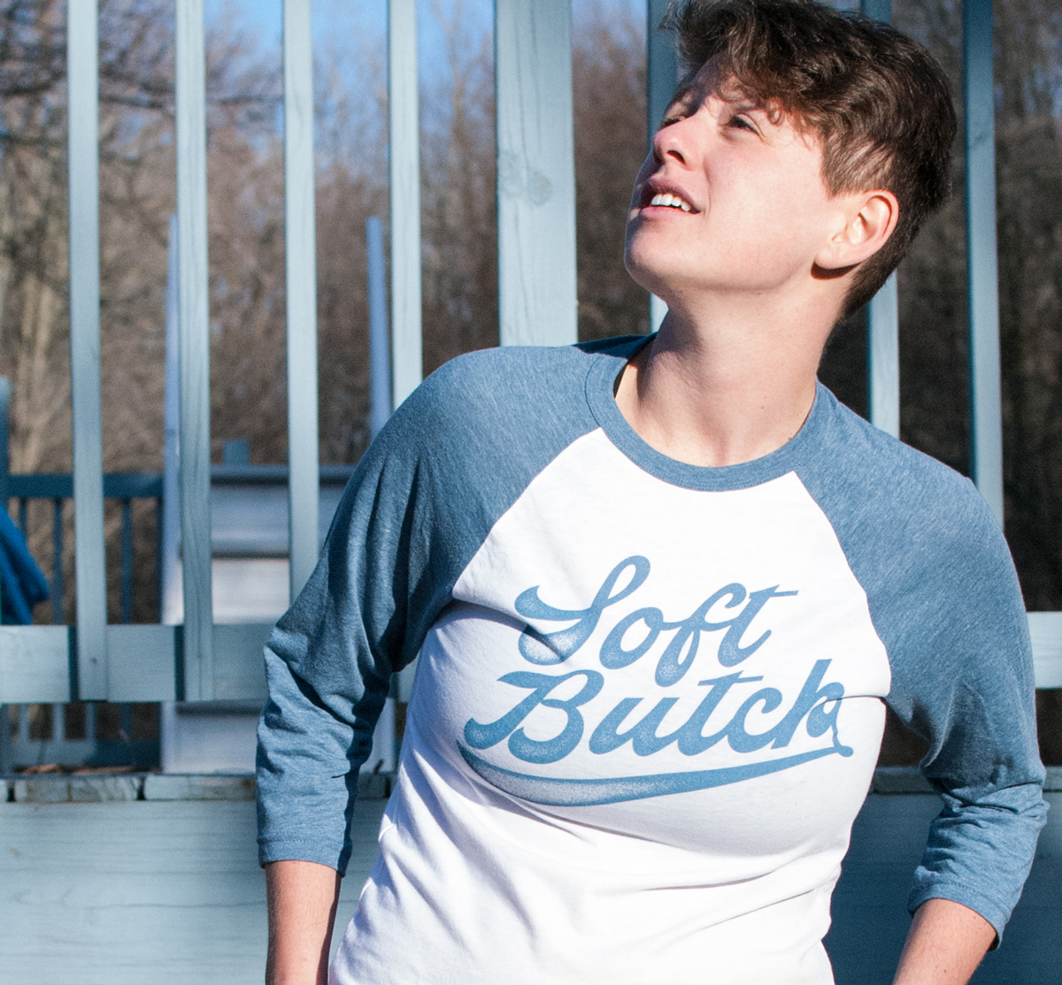 Sarah is wearing the Soft Butch Raglan tee in Small.