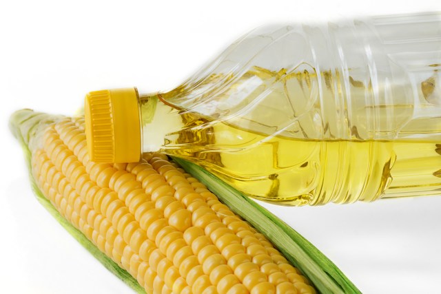 a [suggestive] ear of corn and a bottle of vegetable oil