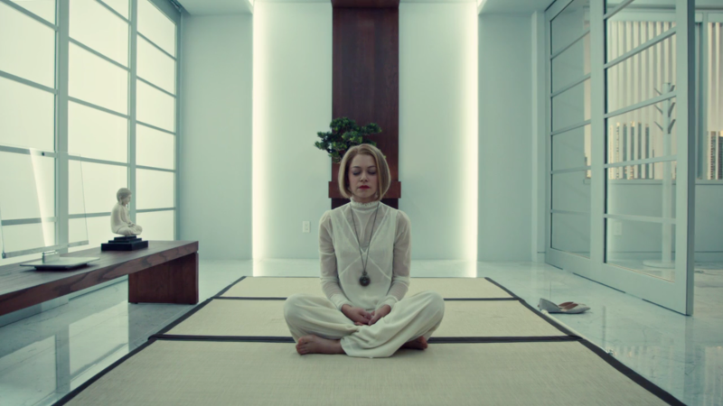 Rachel sits in her white outfit on her white rug in her white room and meditates whitely.