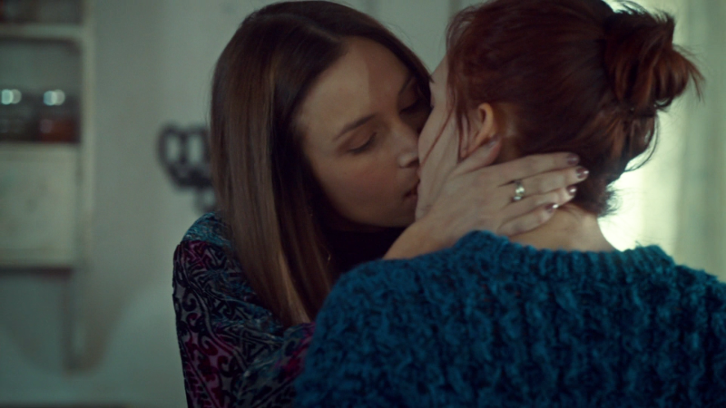 Waverly kisses Nicole, hands on her face and everything