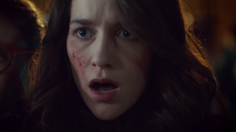 Wynonna's face is horrified as it is splattered with Eliza's blood