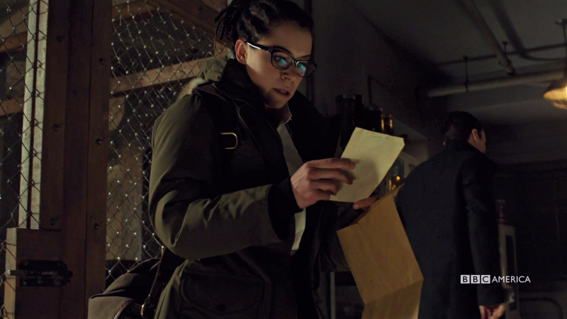 Cosima looks at a piece of paper and is shocked by its contents