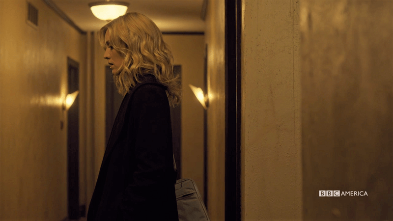 Delphine stands in the hallway looking great and a little shady but it's okay I love her anyway
