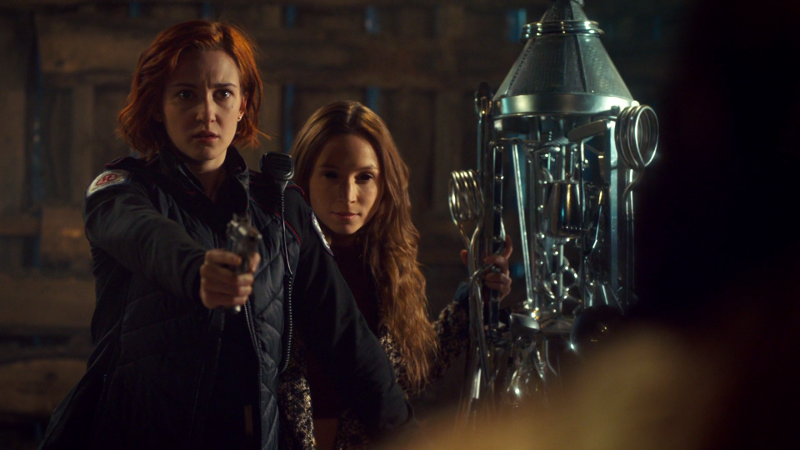 Nicole stands in front of Waverly to protect her