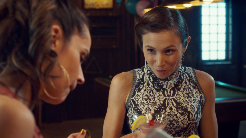 Waverly smirks at Rosita mid-sip