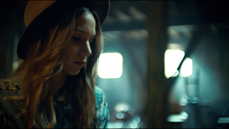 Waverly and her cute hat look down at her box of Earp info