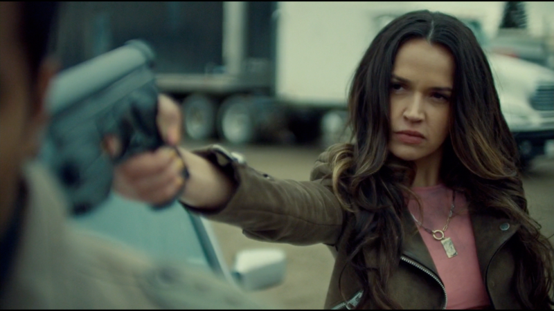 Rosita points a gun at Jeremy looking like a bamf