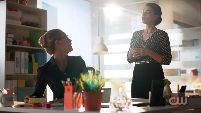 Lena looms over Kara's desk