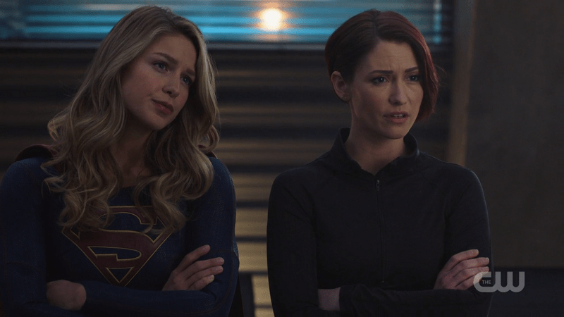 Kara and Alex listen to J'onn intently