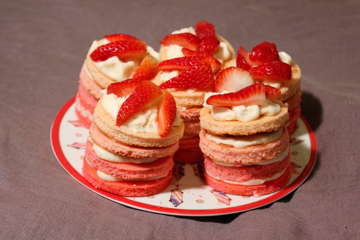 mini ombre cakes with strawberries on top