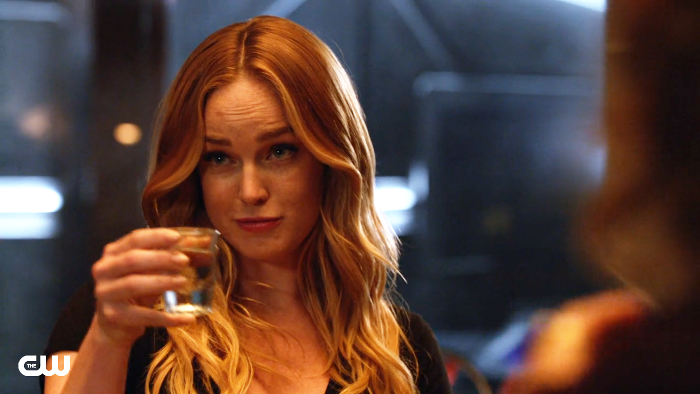 Sara lance toasts a shot glass