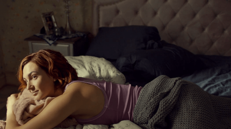 Nicole watches Waverly from bed