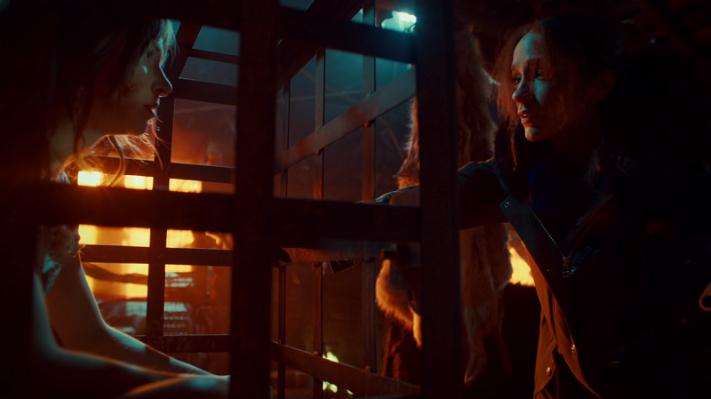 Waverly in a cage, Wynonna outside it