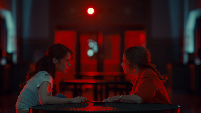 Waverly and Mama talk across a table