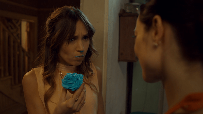 Waverly has blue frosting on her mouth and nose