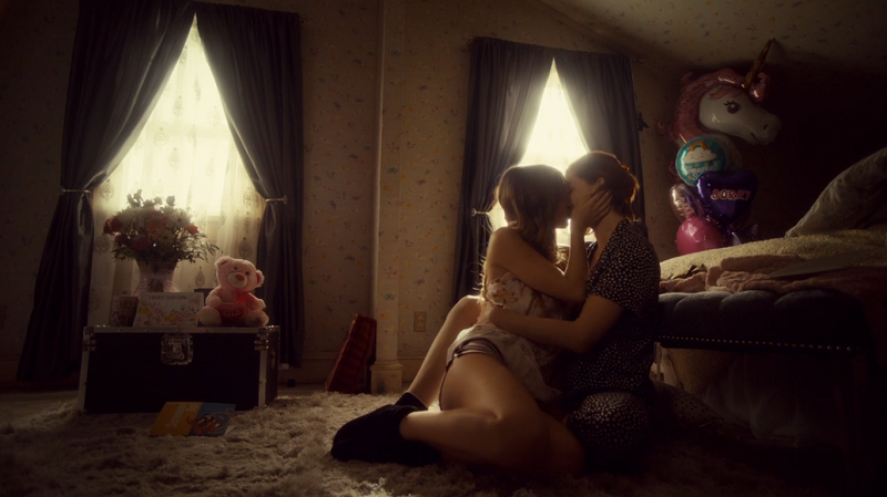 Waverly and Nicole kiss, wrapped up in each other