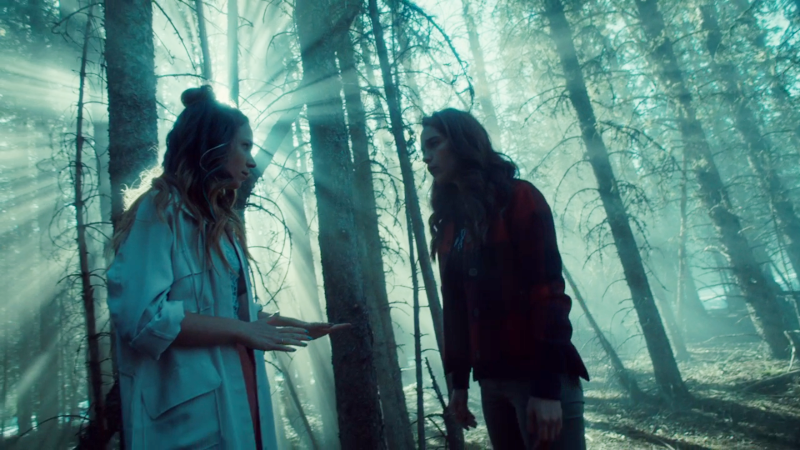 Waverly looks like she has a halo in the woods talking to Wynonna