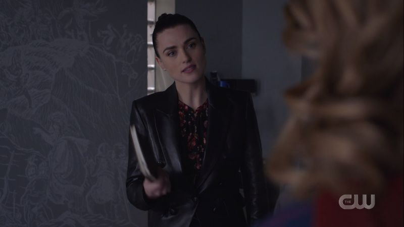 Lena holds one of Lex's diaries in disbelief 