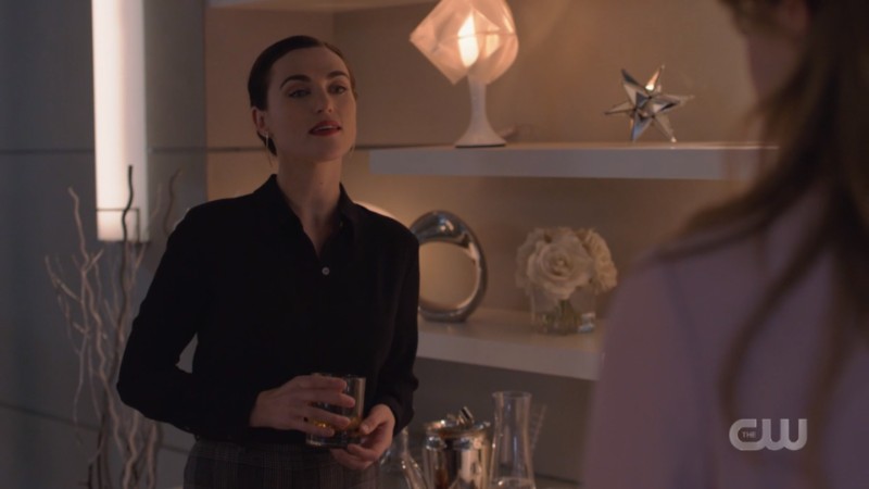 Lena has a drink in her hand and looks pretty bummed