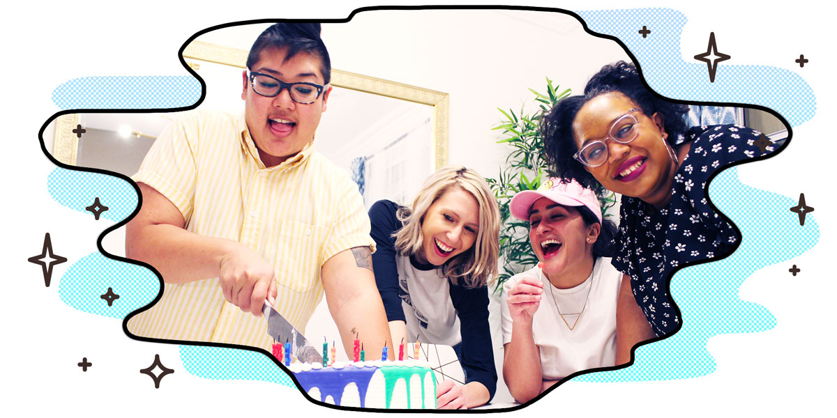 kamala cutting autostraddle's birthday cake at a table with riese, sarah and carmen who are visibily excited at the prospect of celebration and also eating delicious cake