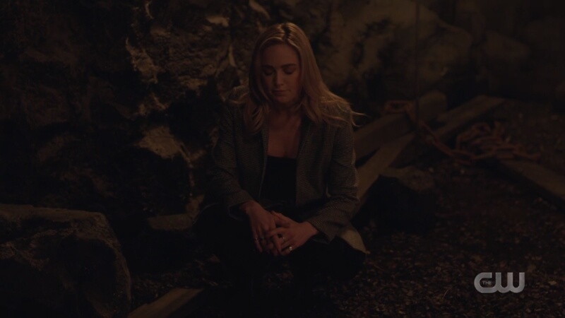 sara looks into the lazarus pit sorrowfully